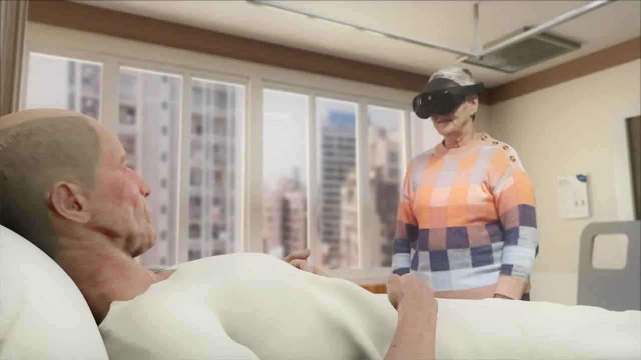 A person reclines in a hospital bed facing someone wearing a mixed-reality headset, city towers filling the window between them
