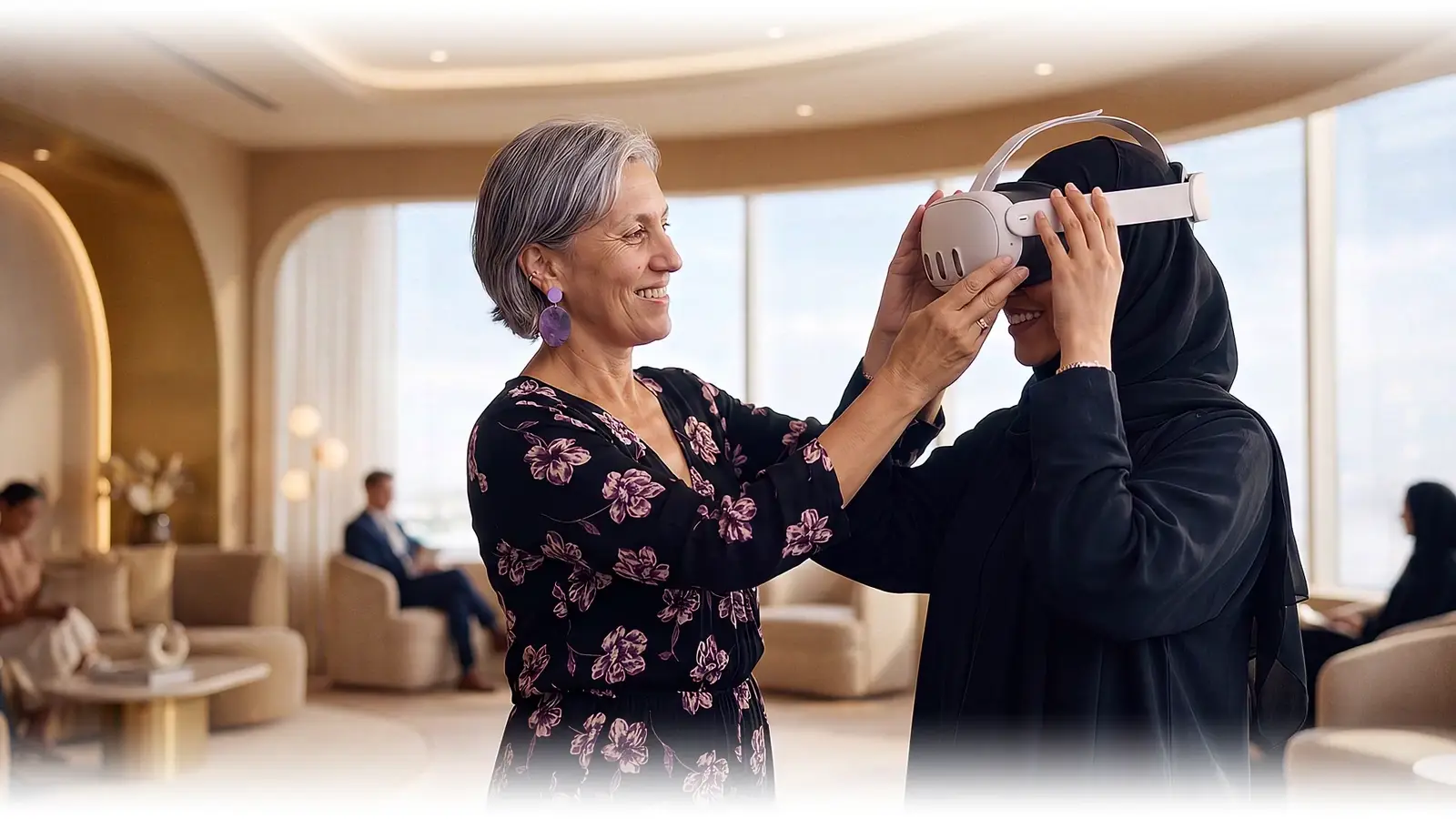 Leonie Sanderson fits a mixed-reality headset onto a participant in a hijab, smiling as she prepares them for a VR experience, in an upscale lounge with other guests seated nearby