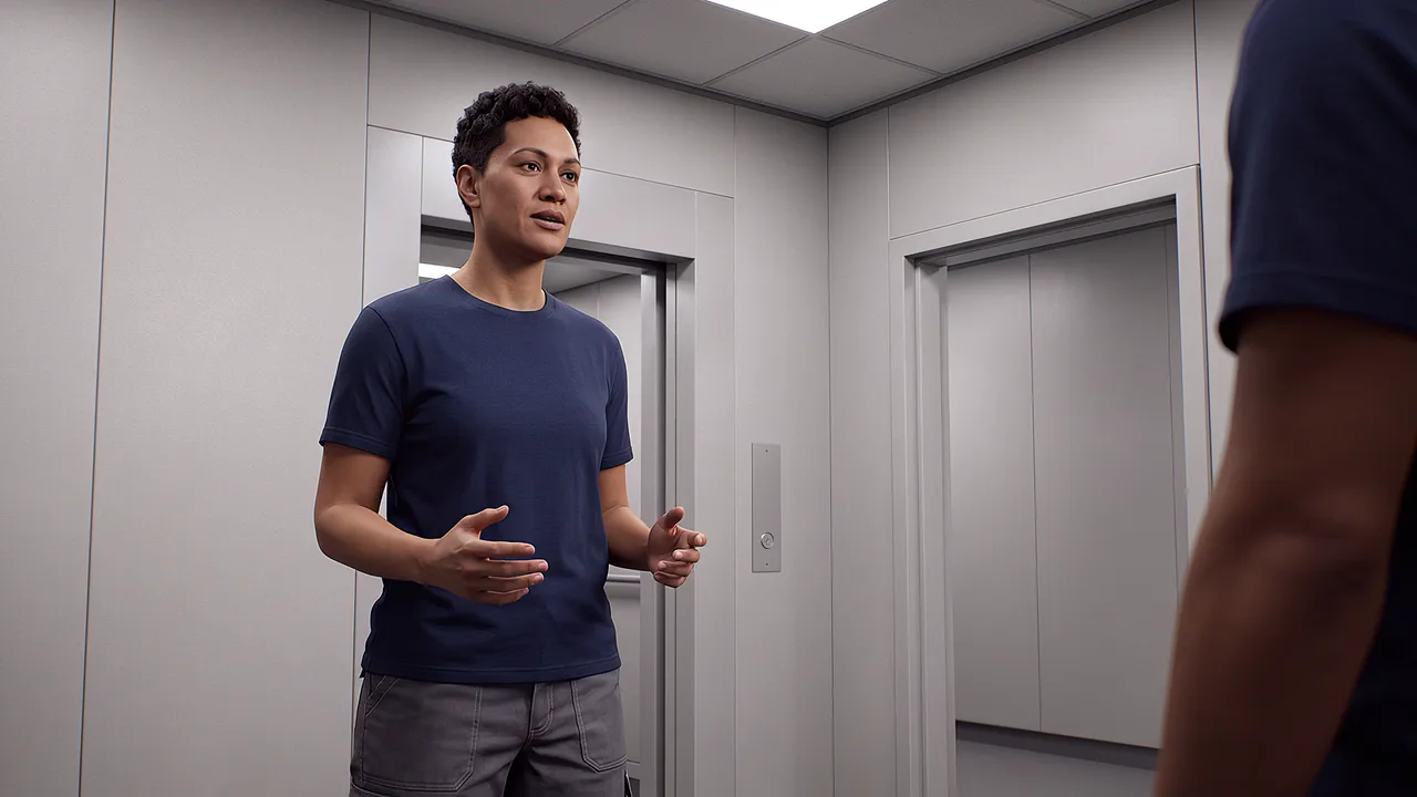 A man stands in a lift lobby facing the closed doors, one hand raised mid-request, another person at the edge of the frame.