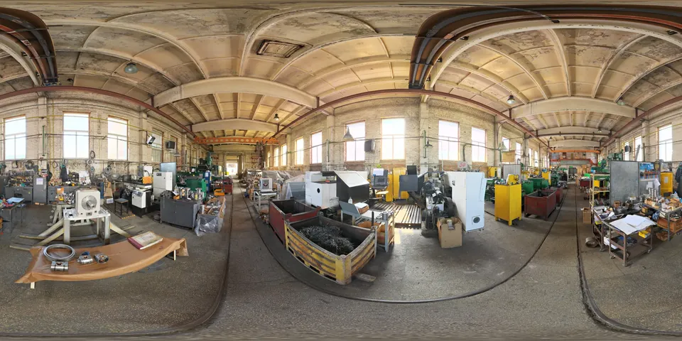 A machine shop. The whole 360 sphere of the scene unwrapped into one wide strip, as the viewer stores it.