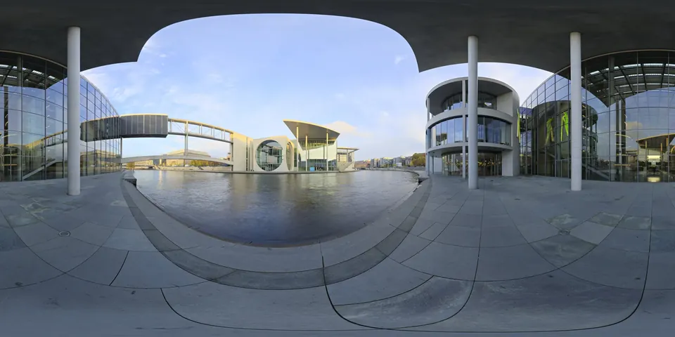 A street among modern buildings. The whole 360 sphere of the scene unwrapped into one wide strip, as the viewer stores it.