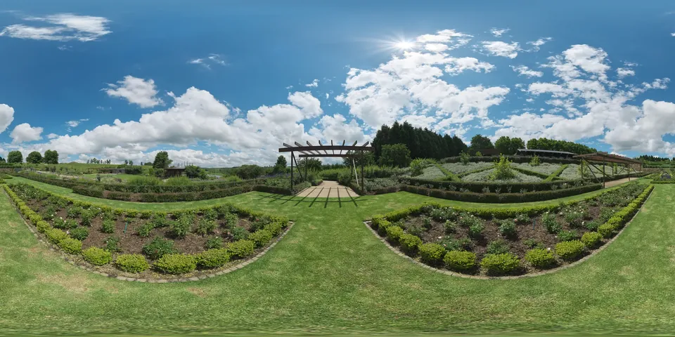 A symmetrical garden. The whole 360 sphere of the scene unwrapped into one wide strip, as the viewer stores it.
