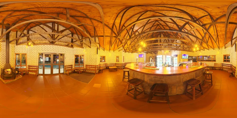 A warmly lit bar. The whole 360 sphere of the scene unwrapped into one wide strip, as the viewer stores it.