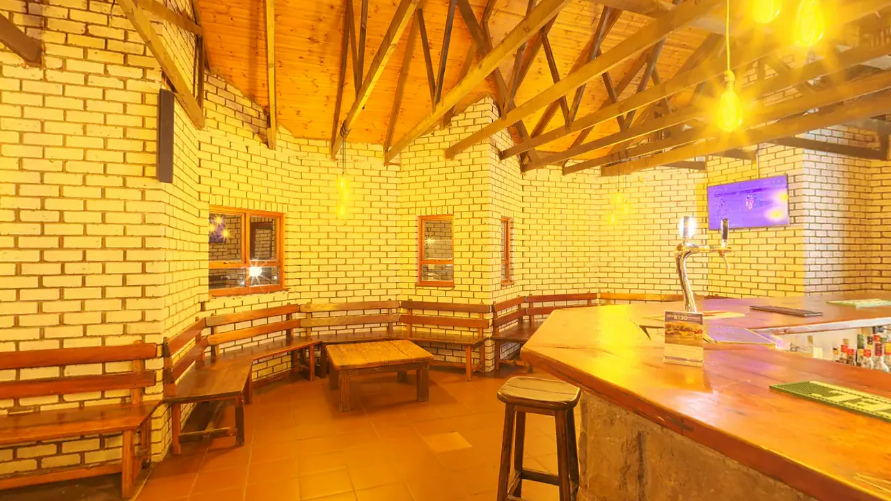 A warmly lit bar. A looping 360 scene built as a Fast Builds 360 experience, shown flat.