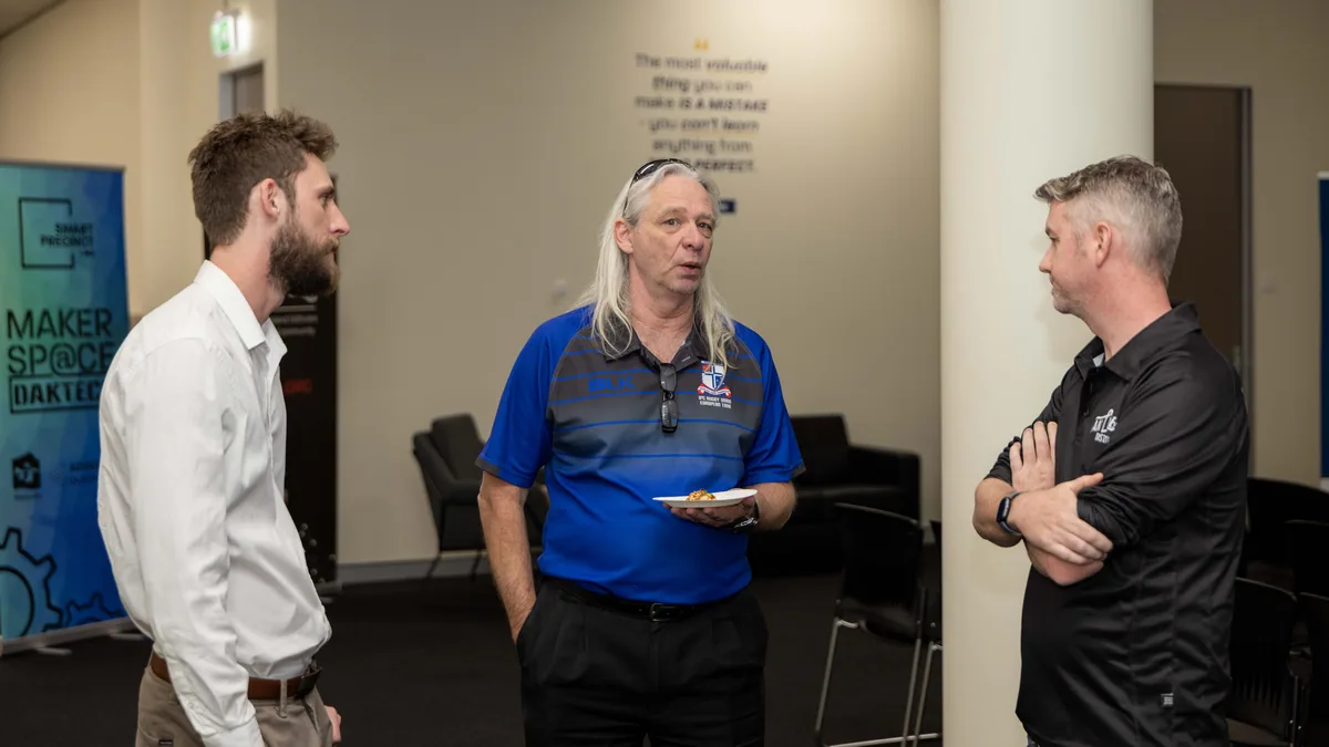 Conversations at the back of the room. PTR VR Library public launch at Smart Precinct NQ, Townsville, 18 July 2024.
