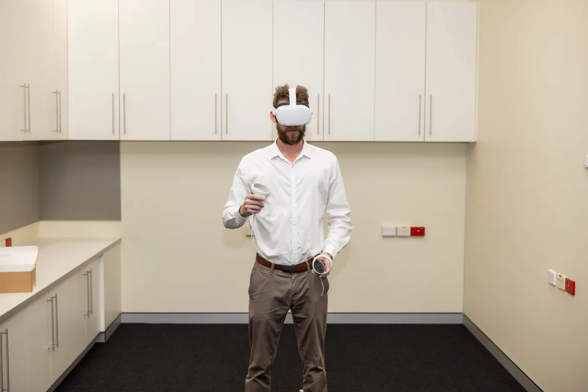 A guest standing inside the experience. PTR VR Library public launch at Smart Precinct NQ, Townsville, 18 July 2024.