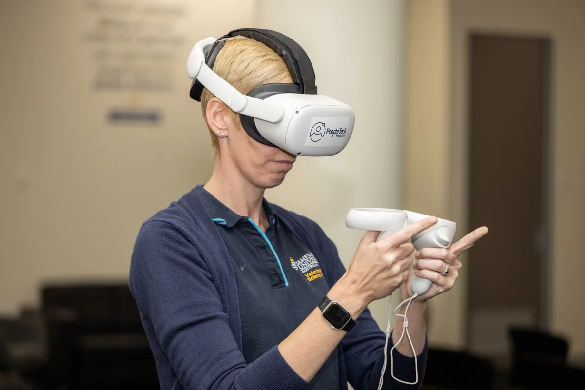Holding the controllers inside the experience. PTR VR Library public launch at Smart Precinct NQ, Townsville, 18 July 2024.