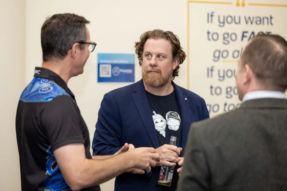 Simon Lowe talking with guests on arrival. PTR VR Library public launch at Smart Precinct NQ, Townsville, 18 July 2024.