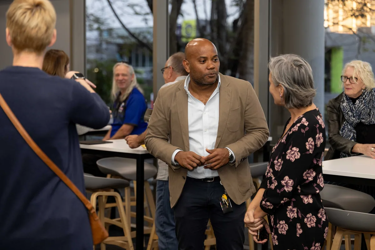 Talking with guests at the high tables. PTR VR Library public launch at Smart Precinct NQ, Townsville, 18 July 2024.