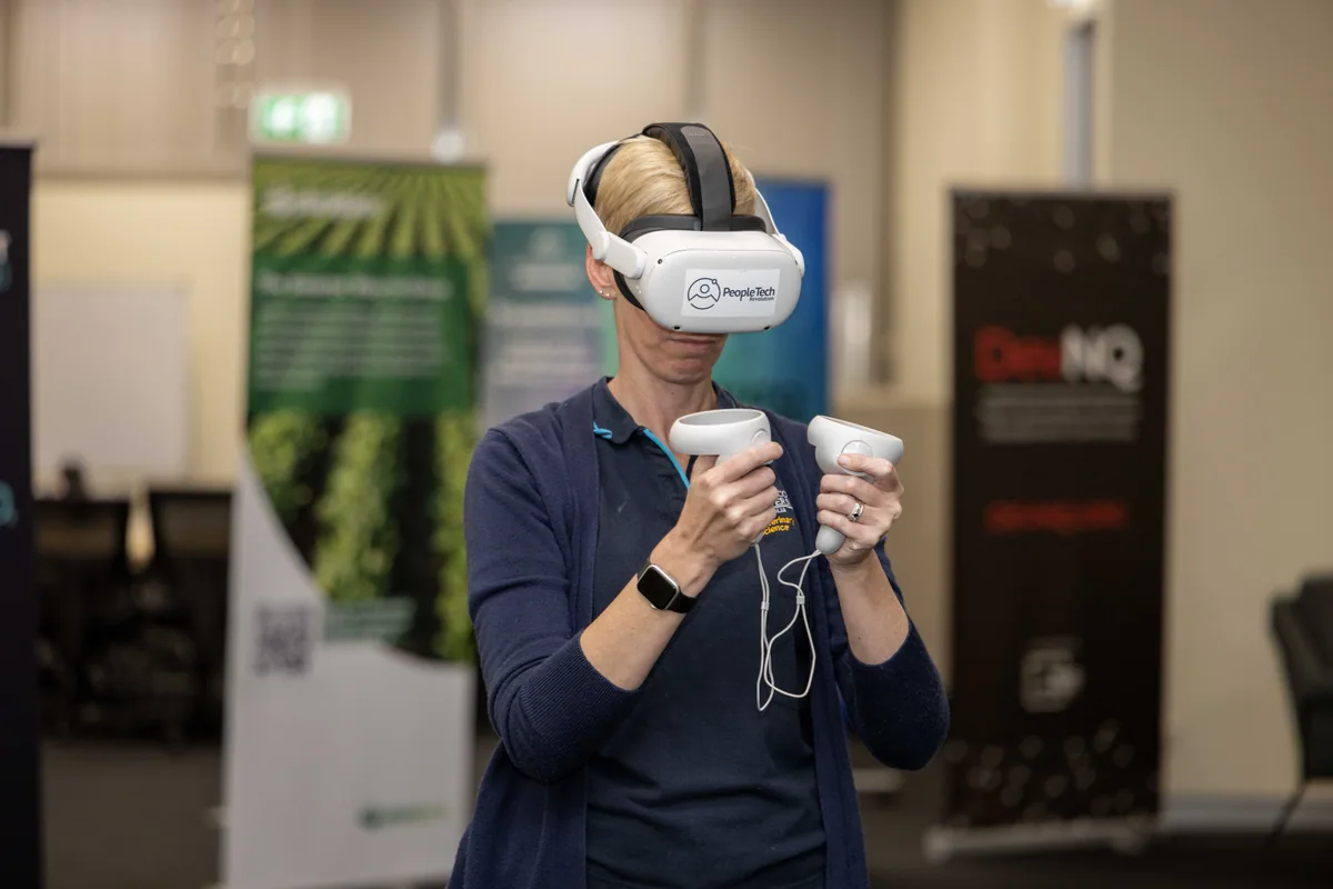 Trying the VR Library at the demo stand. PTR VR Library public launch at Smart Precinct NQ, Townsville, 18 July 2024.