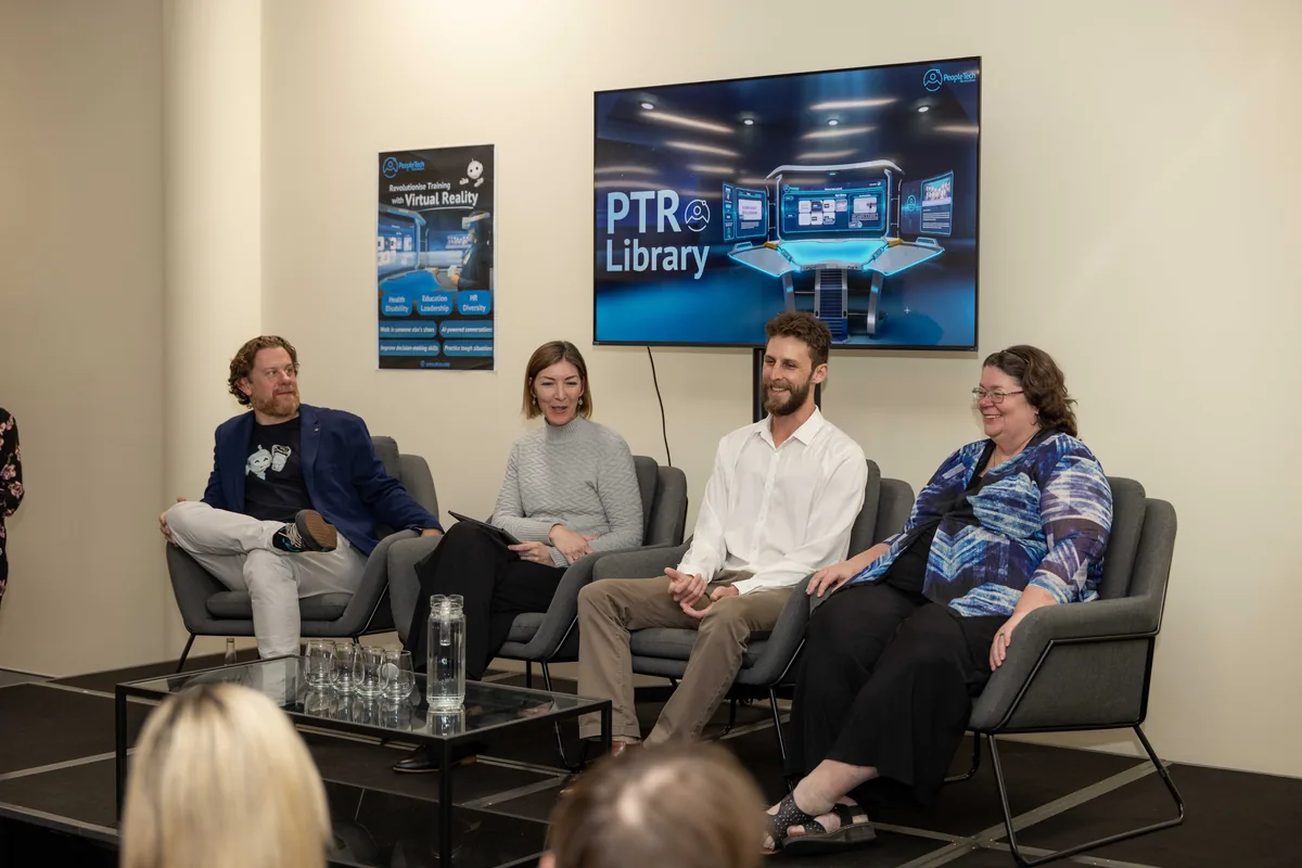 Four panellists seated in a row in front of a screen reading PTR Library, at the 18 July 2024 public launch in Townsville.